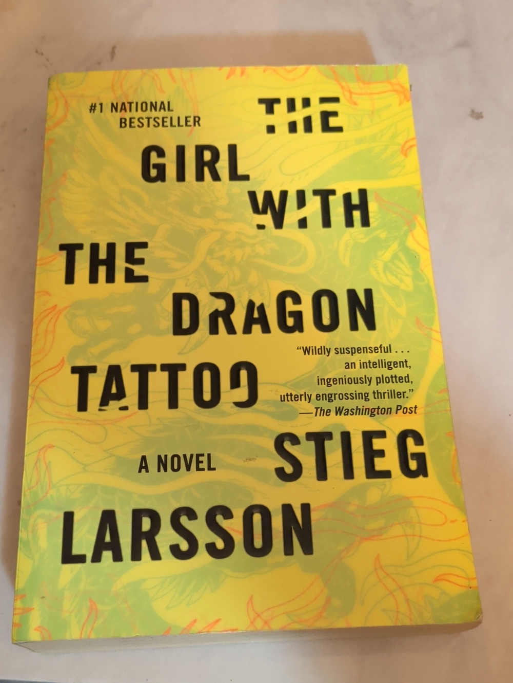 The Girl with the Dragon Tattoo - Yellow Paperback Novel